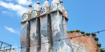 Atop the Casa Batlló, designed by famed architect Antoni Gaudí in Barcelona, Spain