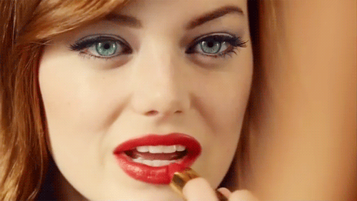 emma stone putting on red lipstick applying lip stick gif