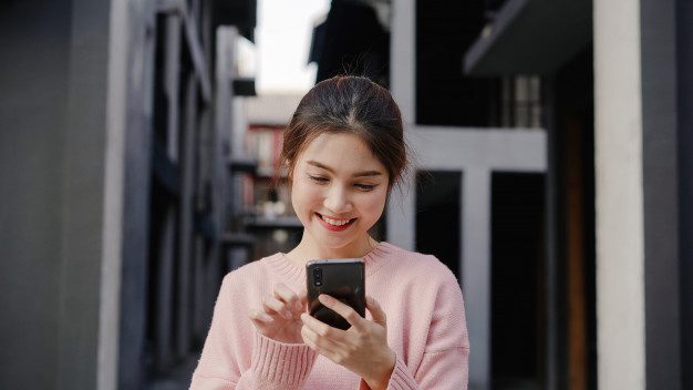 cheerful asian backpacker blogger woman using smartphone direction looking location map while traveling chinatown beijing china lifestyle backpack tourist travel holiday concept 7861 1344