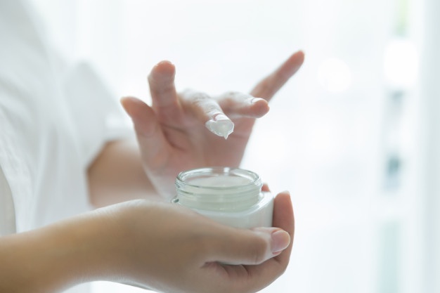 woman holds jar with cosmetic cream her hands 1150 11726