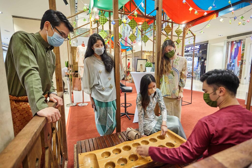 Shoppers able to enjoy a traditional game of congkak or snap Instagram worthy photos with traditional props 11zon