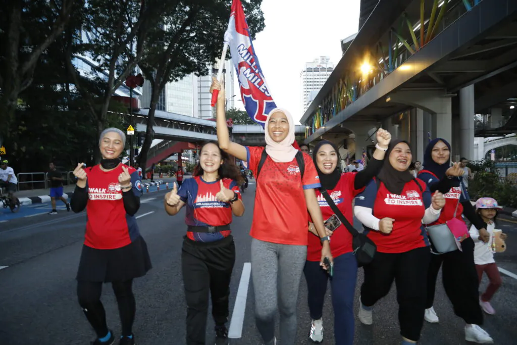 Participants at the KL Car Free Morning event painting the town red in conjunction with World Heart Month